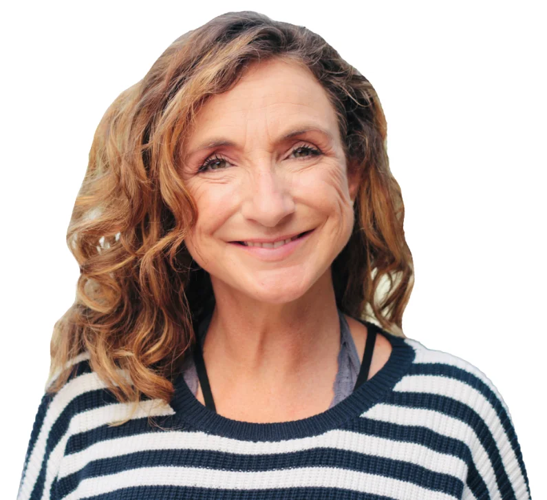 A photo of a woman wearing a black and white striped jumper.